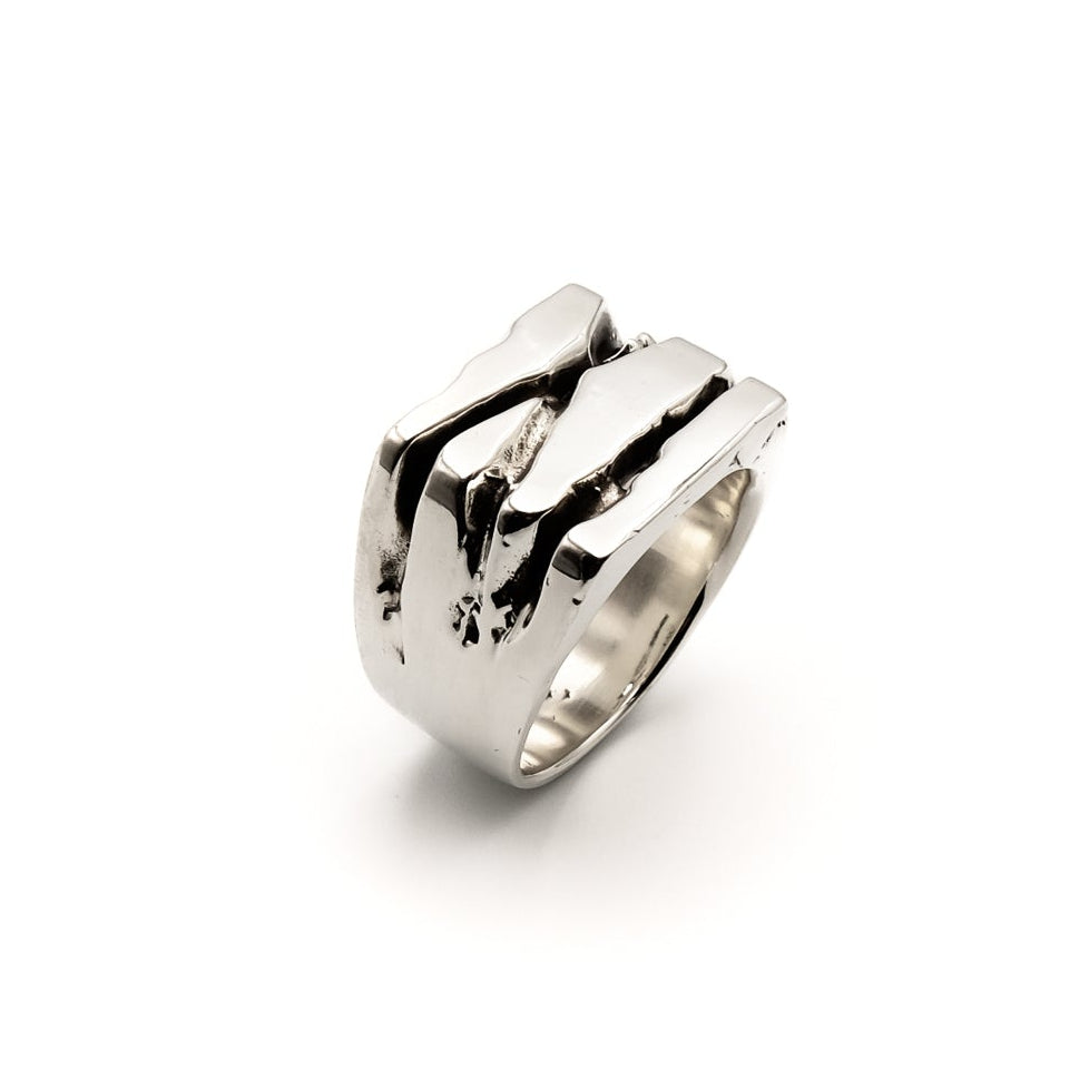 Roman IX Ring — sterling silver ring with oxidised scarring and high polish, angled view