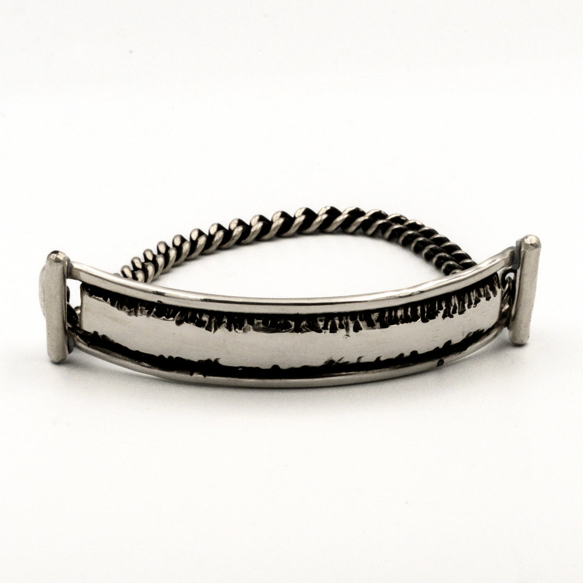 Silver bracelet with a textured band on a white background